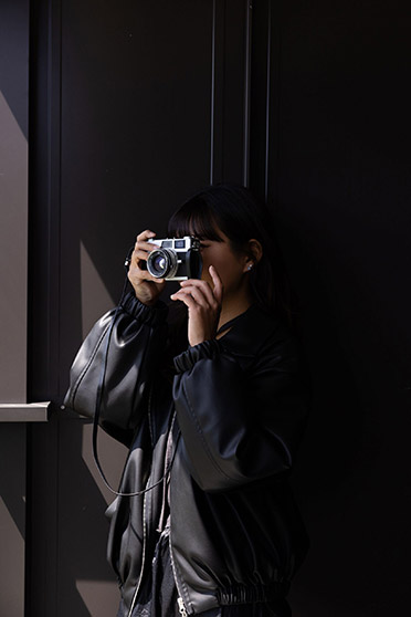 woman with rangefinder camera